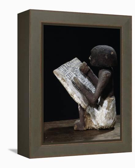 Wooden model of a scribe, Ancient Egyptian, possibly Middle Kingdom-Werner Forman-Framed Premier Image Canvas