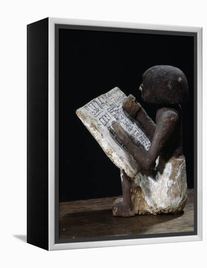 Wooden model of a scribe, Ancient Egyptian, possibly Middle Kingdom-Werner Forman-Framed Premier Image Canvas