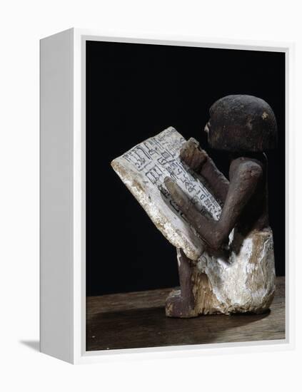 Wooden model of a scribe, Ancient Egyptian, possibly Middle Kingdom-Werner Forman-Framed Premier Image Canvas