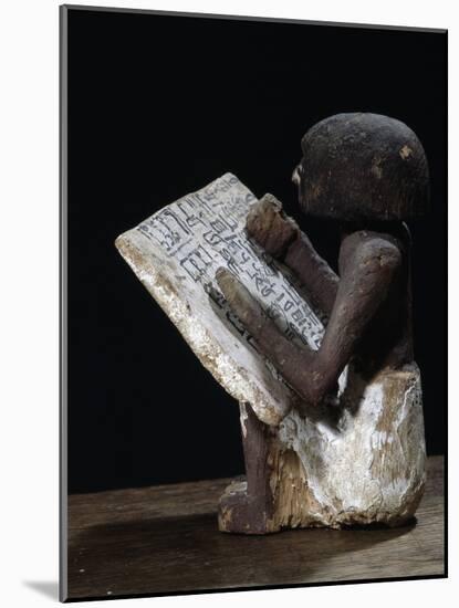 Wooden model of a scribe, Ancient Egyptian, possibly Middle Kingdom-Werner Forman-Mounted Photographic Print