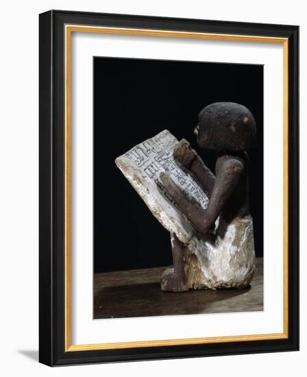 Wooden model of a scribe, Ancient Egyptian, possibly Middle Kingdom-Werner Forman-Framed Photographic Print