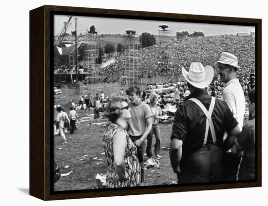 Woodstock, Farmer Max Yasgur Looks On As His Grounds Are Used For Woodstock Festival, 1970-null-Framed Stretched Canvas