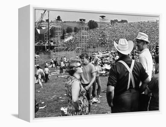 Woodstock, Farmer Max Yasgur Looks On As His Grounds Are Used For Woodstock Festival, 1970-null-Framed Stretched Canvas