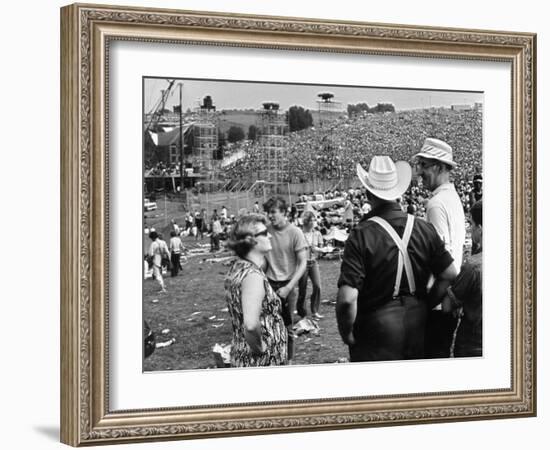 Woodstock, Farmer Max Yasgur Looks On As His Grounds Are Used For Woodstock Festival, 1970-null-Framed Photo