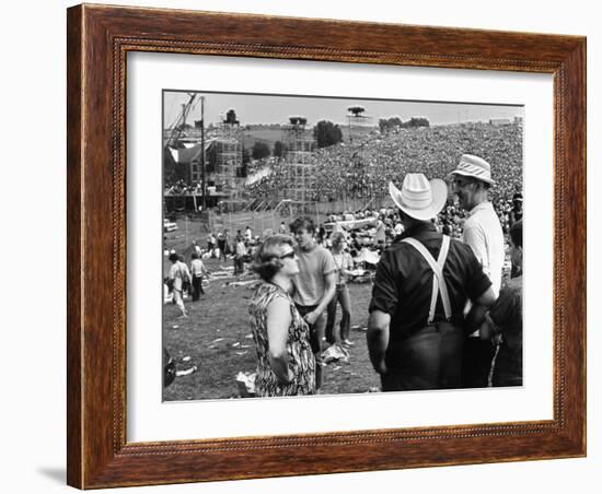 Woodstock, Farmer Max Yasgur Looks On As His Grounds Are Used For Woodstock Festival, 1970-null-Framed Photo