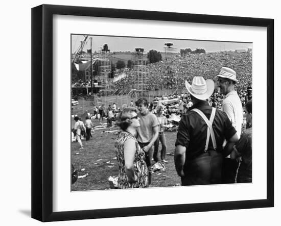 Woodstock, Farmer Max Yasgur Looks On As His Grounds Are Used For Woodstock Festival, 1970-null-Framed Photo