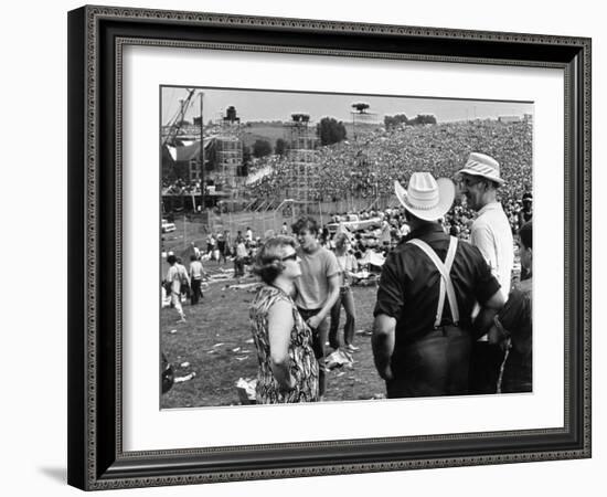 Woodstock, Farmer Max Yasgur Looks On As His Grounds Are Used For Woodstock Festival, 1970-null-Framed Photo