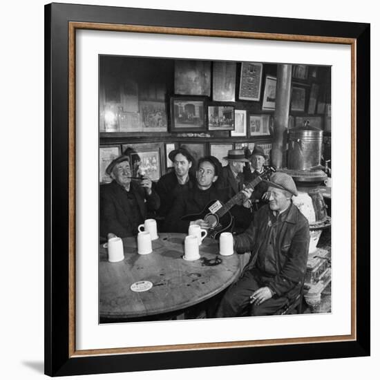 Woody Guthrie Playing and Singing for Patrons of Mcsorley's Bar-Eric Schaal-Framed Premium Photographic Print