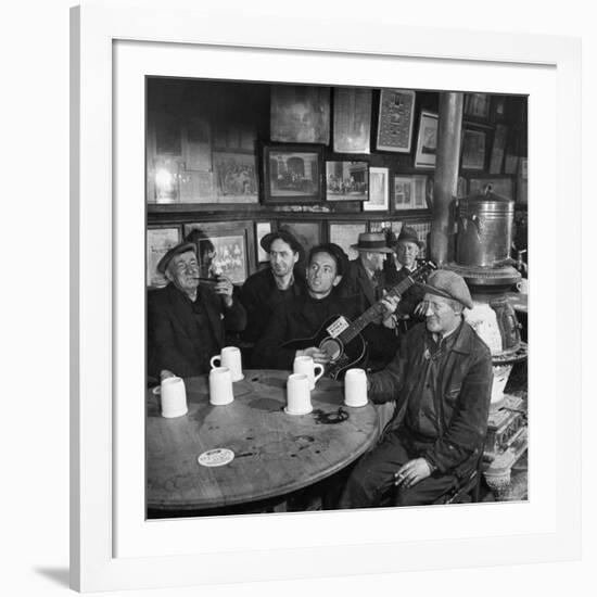 Woody Guthrie Playing and Singing for Patrons of Mcsorley's Bar-Eric Schaal-Framed Premium Photographic Print