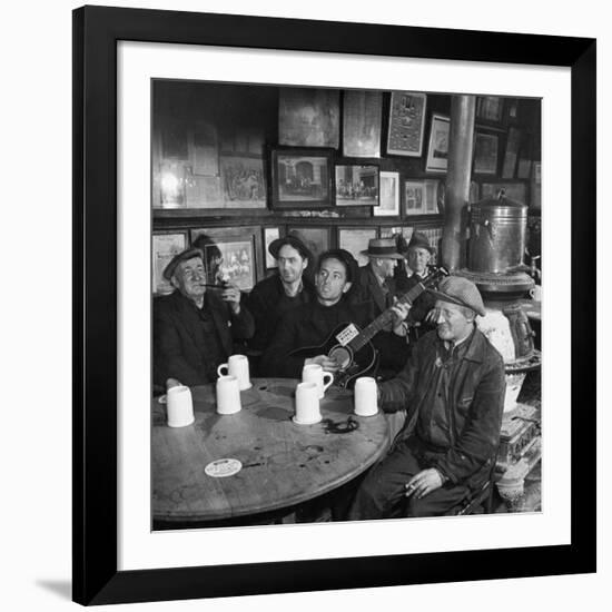 Woody Guthrie Playing and Singing for Patrons of Mcsorley's Bar-Eric Schaal-Framed Premium Photographic Print