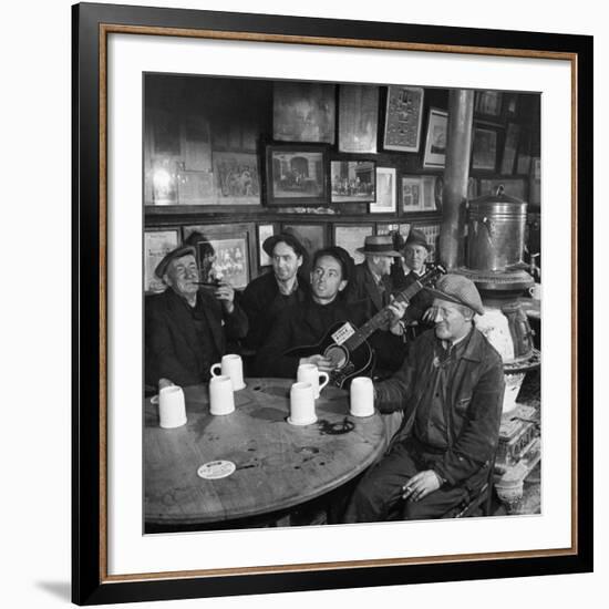 Woody Guthrie Playing and Singing for Patrons of Mcsorley's Bar-Eric Schaal-Framed Premium Photographic Print