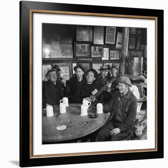 Woody Guthrie Playing and Singing for Patrons of Mcsorley's Bar-Eric Schaal-Framed Premium Photographic Print