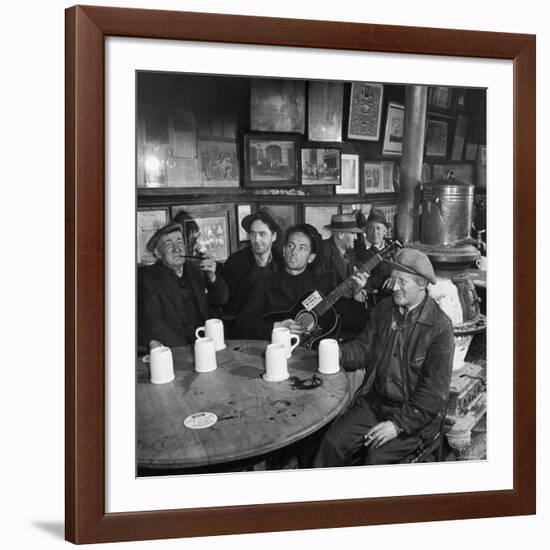 Woody Guthrie Playing and Singing for Patrons of Mcsorley's Bar-Eric Schaal-Framed Premium Photographic Print