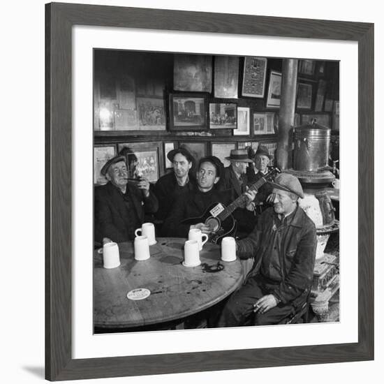 Woody Guthrie Playing and Singing for Patrons of Mcsorley's Bar-Eric Schaal-Framed Premium Photographic Print