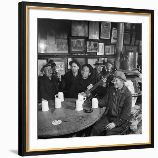 Woody Guthrie Playing and Singing for Patrons of Mcsorley's Bar-Eric Schaal-Framed Premium Photographic Print