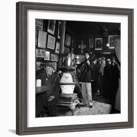 Woody Guthrie Playing in McSorley's Pub-Eric Schaal-Framed Premium Photographic Print