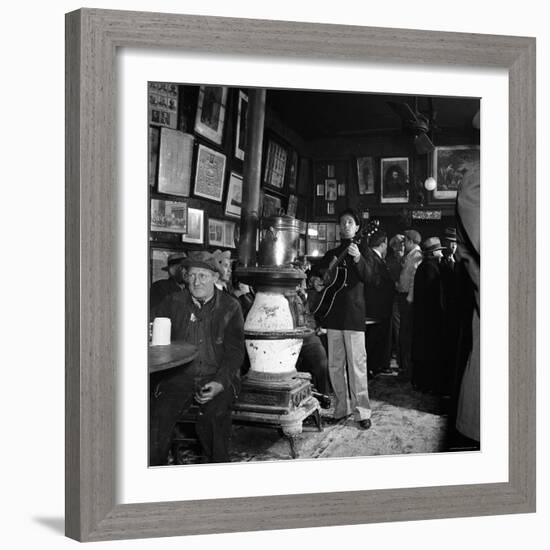 Woody Guthrie Playing in McSorley's Pub-Eric Schaal-Framed Premium Photographic Print