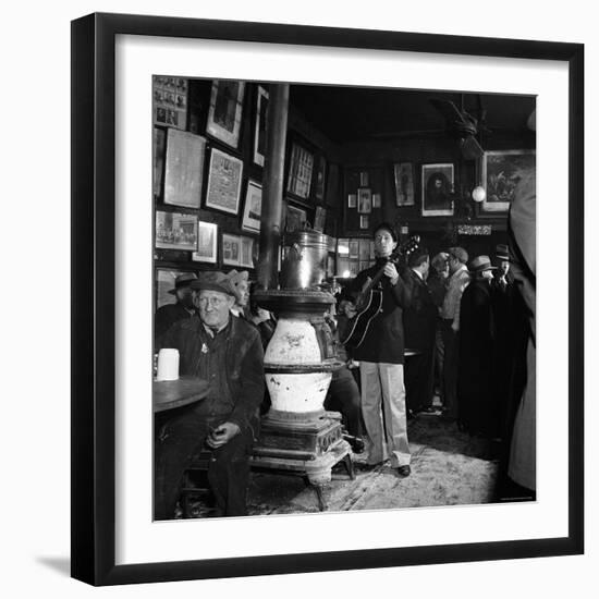 Woody Guthrie Playing in McSorley's Pub-Eric Schaal-Framed Premium Photographic Print