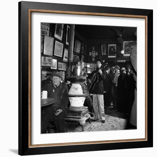 Woody Guthrie Playing in McSorley's Pub-Eric Schaal-Framed Premium Photographic Print