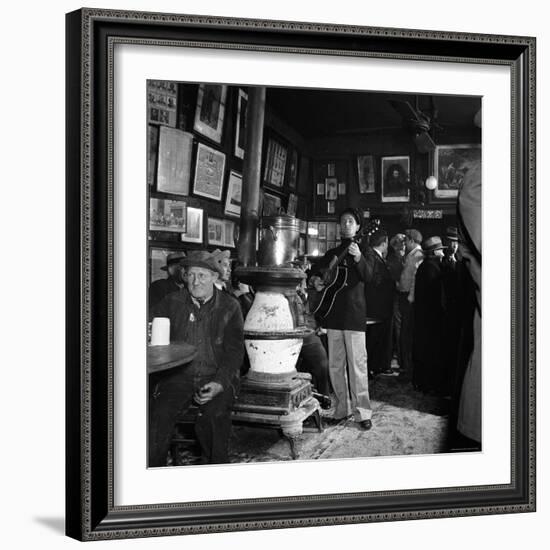 Woody Guthrie Playing in McSorley's Pub-Eric Schaal-Framed Premium Photographic Print