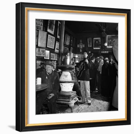 Woody Guthrie Playing in McSorley's Pub-Eric Schaal-Framed Premium Photographic Print