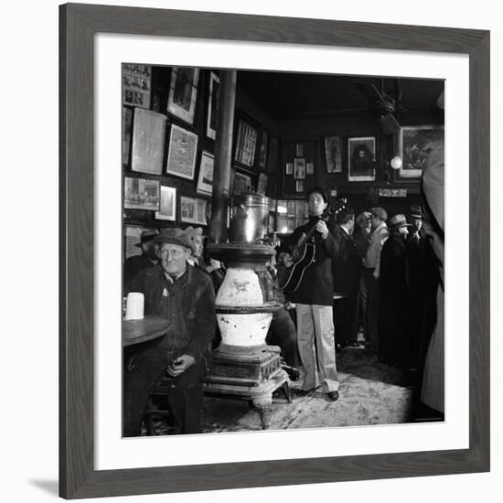 Woody Guthrie Playing in McSorley's Pub-Eric Schaal-Framed Premium Photographic Print