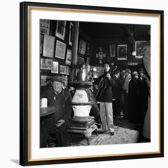 Woody Guthrie Playing in McSorley's Pub-Eric Schaal-Framed Premium Photographic Print