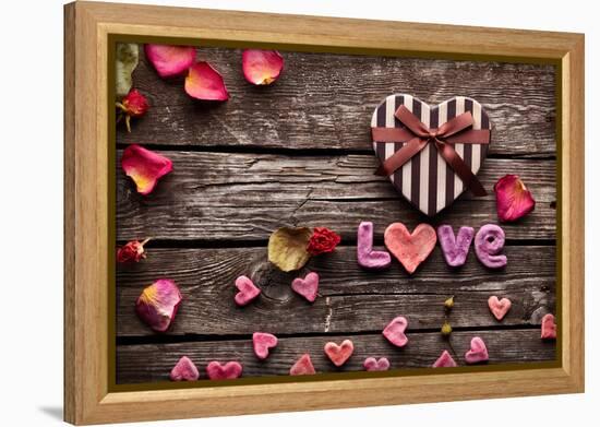 Word Love With Heart Shaped Valentines Day Gift Box On Old Vintage Wooden Plates-ouh_desire-Framed Premier Image Canvas