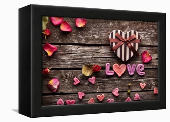 Word Love With Heart Shaped Valentines Day Gift Box On Old Vintage Wooden Plates-ouh_desire-Framed Premier Image Canvas