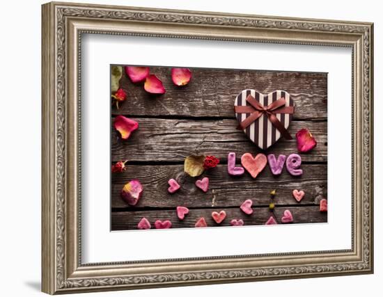 Word Love With Heart Shaped Valentines Day Gift Box On Old Vintage Wooden Plates-ouh_desire-Framed Photographic Print