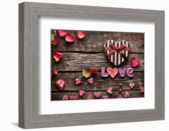 Word Love With Heart Shaped Valentines Day Gift Box On Old Vintage Wooden Plates-ouh_desire-Framed Photographic Print