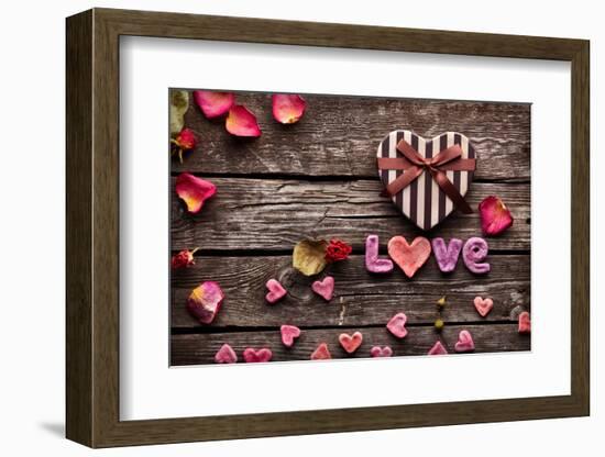 Word Love With Heart Shaped Valentines Day Gift Box On Old Vintage Wooden Plates-ouh_desire-Framed Photographic Print