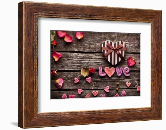 Word Love With Heart Shaped Valentines Day Gift Box On Old Vintage Wooden Plates-ouh_desire-Framed Photographic Print