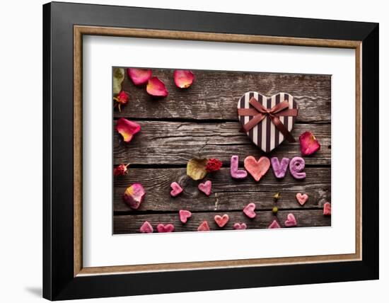 Word Love With Heart Shaped Valentines Day Gift Box On Old Vintage Wooden Plates-ouh_desire-Framed Photographic Print