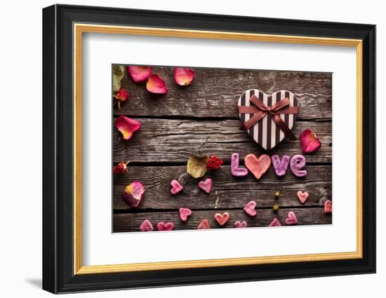 Word Love With Heart Shaped Valentines Day Gift Box On Old Vintage Wooden Plates-ouh_desire-Framed Photographic Print