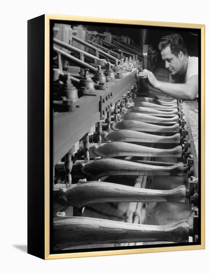 Worker Carving Chair Legs, 24 at a Time, at a Tomlinson Furniture Factory-Margaret Bourke-White-Framed Premier Image Canvas