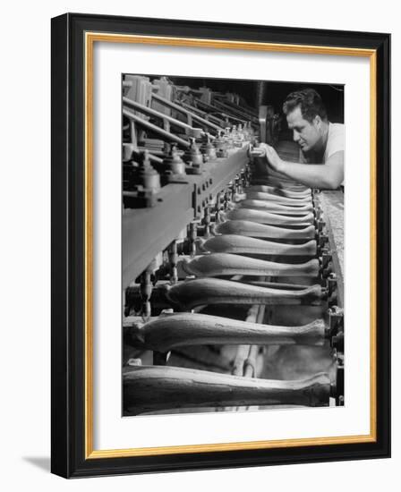 Worker Carving Chair Legs, 24 at a Time, at a Tomlinson Furniture Factory-Margaret Bourke-White-Framed Photographic Print