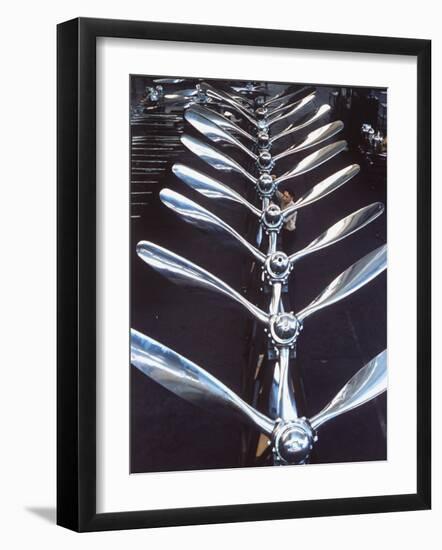 Worker Checking Row of Gleaming Airplane Propellers at Pratt and Whitney Aircraft Parts Factory-Dmitri Kessel-Framed Photographic Print