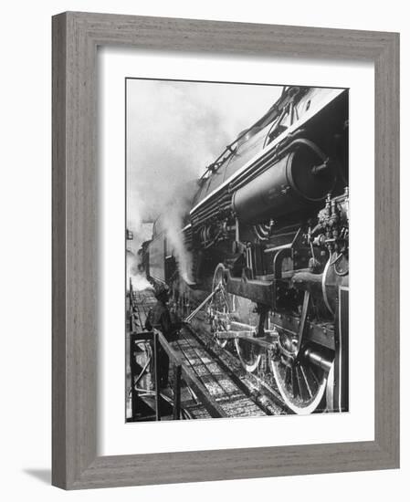 Worker Cleaning Train Engine in Yard at Union Station-Alfred Eisenstaedt-Framed Photographic Print