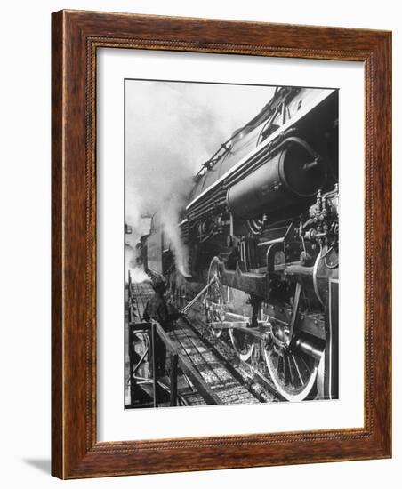 Worker Cleaning Train Engine in Yard at Union Station-Alfred Eisenstaedt-Framed Photographic Print
