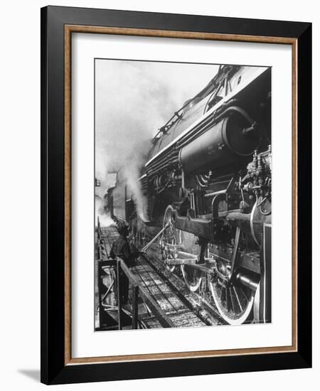 Worker Cleaning Train Engine in Yard at Union Station-Alfred Eisenstaedt-Framed Photographic Print