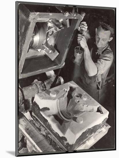 Worker Finishing Sand Mold for an Air-Cooled Airplane Cylinder Head, Aluminum Co. Factory-Margaret Bourke-White-Mounted Photographic Print