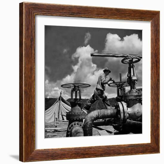 Worker Opening up a Pipeline to Let the Oil Flow-Thomas D^ Mcavoy-Framed Photographic Print