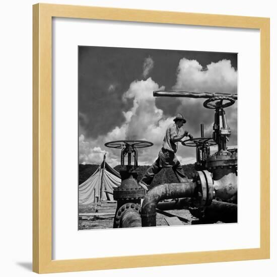 Worker Opening up a Pipeline to Let the Oil Flow-Thomas D^ Mcavoy-Framed Photographic Print