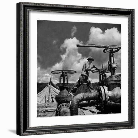 Worker Opening up a Pipeline to Let the Oil Flow-Thomas D^ Mcavoy-Framed Photographic Print