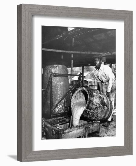 Worker Pouring Gum from Pine Trees into a Still During Turpentine Production-Hansel Mieth-Framed Photographic Print