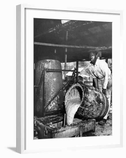 Worker Pouring Gum from Pine Trees into a Still During Turpentine Production-Hansel Mieth-Framed Photographic Print