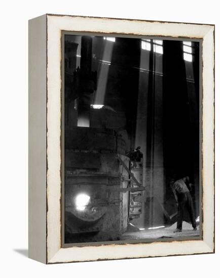 Worker Shoveling Limestone Into an Electric Blast Furnace at Republic Steel Mill-Margaret Bourke-White-Framed Premier Image Canvas