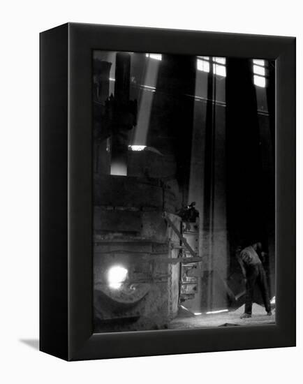 Worker Shoveling Limestone Into an Electric Blast Furnace at Republic Steel Mill-Margaret Bourke-White-Framed Premier Image Canvas