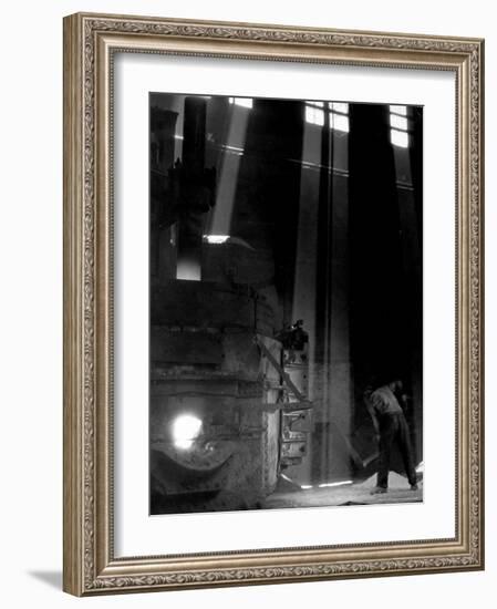 Worker Shoveling Limestone Into an Electric Blast Furnace at Republic Steel Mill-Margaret Bourke-White-Framed Photographic Print